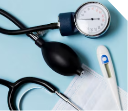 A blood pressure monitor, stethoscope, digital thermometer, and disposable face mask are arranged on a light blue background.